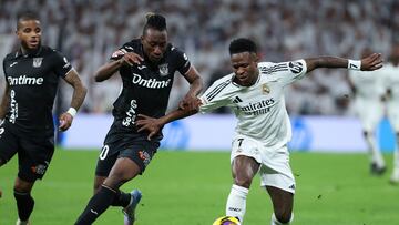 Real Madrid's Brazilian forward #07 Vinicius Junior (R) controls the ball challenged by Leganes' Ivorian forward #30 Yan Diomande during the Spanish league football match between Real Madrid CF and Club Deportivo Leganes SAD at the Santiago Bernabeu stadium in Madrid on March 29, 2025. (Photo by Thomas COEX / AFP)