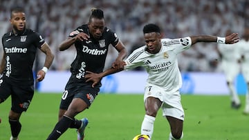 Real Madrid's Brazilian forward #07 Vinicius Junior (R) controls the ball challenged by Leganes' Ivorian forward #30 Yan Diomande during the Spanish league football match between Real Madrid CF and Club Deportivo Leganes SAD at the Santiago Bernabeu stadium in Madrid on March 29, 2025. (Photo by Thomas COEX / AFP)