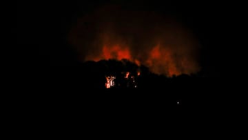 Maduro declares a state of emergency and accuses the U.S. of military aggression amid reports of overnight blasts and air activity.