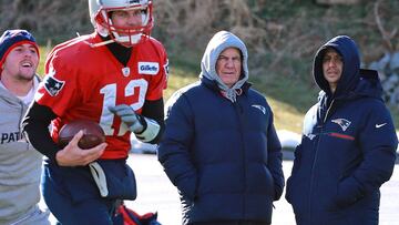 (12/20/2017- Foxboro, MA) New England Patriots head coach Bill Belichick chats with head strength and conditioning coach Moses Cabrera as he keeps an eye on quarterback Tom Brady during practice at Gillette Stadium  on Wednesday, December 20, 2017. Staff 