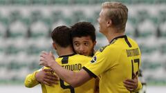 Dortmund&#039;s Achraf Hakimi, left, celebrates with Jadon Sancho and Erling Haaland, right, after scoring his side&#039;s second goal during the German Bundesliga soccer match between VfL Wolfsburg and Borussia Dortmund in Wolfsburg, Germany, Saturday, M