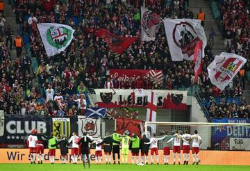 Leipzig's players celebrate with their fans after the German first division Bundesliga football match between RB Leipzig and Mainz 05