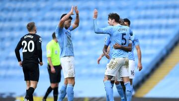 MANCHESTER, ENGLAND - FEBRUARY 27: Ruben Dias and John Stones of Manchester City celebrate following their team&#039;s victory in the Premier League match between Manchester City and West Ham United at Etihad Stadium on February 27, 2021 in Manchester, En