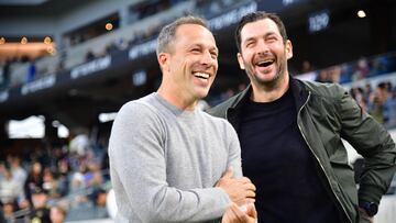 Apr 20, 2024; Los Angeles, California, USA; LAFC head coach Steve Cherundolo and New York Red Bulls head coach Sandro Schwarz smile before the game at BMO Stadium. Mandatory Credit: Gary A. Vasquez-USA TODAY Sports