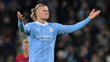 Manchester City's Norwegian striker #09 Erling Haaland rallies the crowd after scoring the team's first goal during the UEFA Champions League Group G football match between Manchester City and RG Leipzig at the Etihad Stadium, in Manchester, north west England, on November 28, 2023. (Photo by Paul ELLIS / AFP)