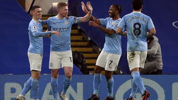 03 January 2021, England, London: Manchester City's Phil Foden (L) celebrates scoring his side's second goal with teammates during the English Premier League soccer match between Chelsea and Manchester City at Stamford Bridge. Photo: Ian Wa