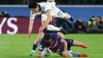 FC Copenhagen's Japanese midfielder #20 Junnosuke Suzuki (top) collides with Barcelona's Spanish defender #24 Eric Garcia during the UEFA Champions League league phase day 8 football match between FC Barcelona and FC Copenhagen at the Camp Nou Stadium in Barcelona on Janaury 28, 2026. (Photo by Lluis GENE / AFP)