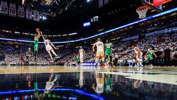 Jayson Tatum #0 of the Boston Celtics shoots over Caleb Martin #16