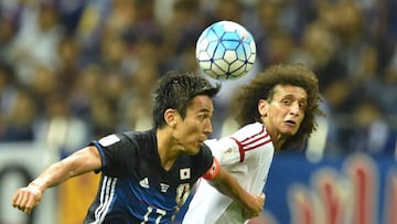 United Arab Emirates (UAE) midfielder Omar Abdulrahman (R) and Japan&#039;s midfielder Makoto Hasebe (L) fight for the ball during their football match in the final round of Asian qualifiers for the 2018 World Cup at Saitama Stadium on September 1, 2016. 