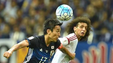 United Arab Emirates (UAE) midfielder Omar Abdulrahman (R) and Japan&#039;s midfielder Makoto Hasebe (L) fight for the ball during their football match in the final round of Asian qualifiers for the 2018 World Cup at Saitama Stadium on September 1, 2016. 