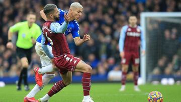 Aston Villa's Brazilian midfielder Douglas Luiz (L) vies for the ball against Everton's Brazilian striker Richarlison (back) during the English Premier League football match between Everton and Aston Villa at Goodison Park in Liverpool, north we