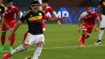 Colombia's Radamel Falcao shoots to score a penalty against Kuwait during their friendly football match at the Sheikh Zayed Stadium in Abu Dhabi on March 30, 2015. AFP PHOTO/MARWAN NAAMANI