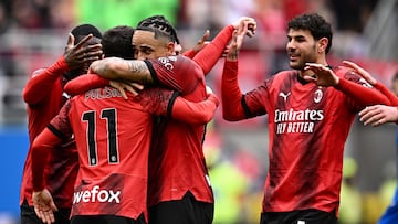 AC Milan's Swiss forward #17 Noah Okafor and AC Milan's French defender #19 Theo Hernandez celebrate a goal scored by AC Milan's American forward #11 Christian Pulisic during the Italian Serie A football match between AC Milan and Empoli at San Siro stadium in Milan, on March 10, 2024. (Photo by GABRIEL BOUYS / AFP)