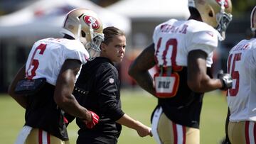 Katie Sowers, a coaching intern for the San Francisco 49ers, keeps an eye on training camp in Santa Clara, California, Tuesday, Aug. 8, 2017. (Karl Mondon/Bay Area News Group)