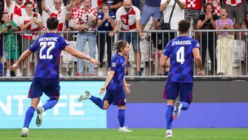 Croatia's midfielder Luka Modric (C) celebrates after scoring a goal during the UEFA Nations League League A - Group A1 first leg football match between Croatia and Poland at the Opus Arena in Osijek on September 8, 2024. (Photo by Damir SENCAR / AFP)
