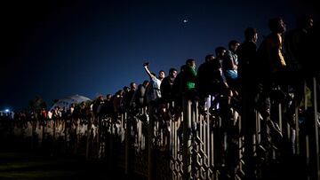 People watch a live broadcast of the 2022 World Cup opening match