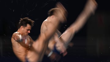 Britain's Thomas Daley and Britain's Noah Williams warm up ahead of the final of the men's 10m platform synchro diving event during the 2024 World Aquatics Championships at Hamad Aquatics Centre in Doha on February 8, 2024. (Photo by Oli SCARFF / AFP)