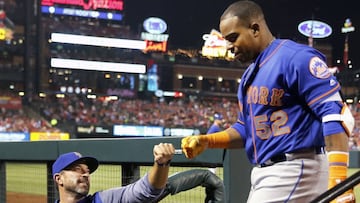 FILE - In this April 24, 2018, file photo, New York Mets' Yoenis Cespedes (52) is congratulated by manager Mickey Callaway after hitting a three-run home run during the fifth inning of a baseball game against the St. Louis Cardinals in St. Louis. The slumping Mets have announced they are sticking with embattled manager Callaway "for the foreseeable future" _ and sidelined slugger Cespedes broke his right ankle in an accident on his ranch. (AP Photo/Jeff Roberson, File)
