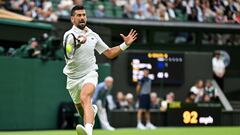 Serbia's Novak Djokovic returns the ball to Czech Republic's Vit Kopriva during their men's singles tennis match on the second day of the 2024 Wimbledon Championships at The All England Lawn Tennis and Croquet Club in Wimbledon, southwest London, on July 2, 2024. (Photo by ANDREJ ISAKOVIC / AFP) / RESTRICTED TO EDITORIAL USE