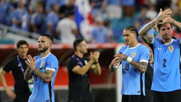 Uruguay's defender #08 Nahitan Nandez, Uruguay's forward #19 Darwin Nunez and Uruguay's defender #02 Jose Maria Gimenez acknowledge supporter after their team's victory in the Conmebol 2024 Copa America tournament group C football match between Uruguay and Panama at Hard Rock Stadium in Miami, Florida on June 23, 2024. (Photo by Chris ARJOON / AFP)