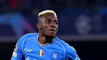 Napoli's Nigerian forward #09 Victor Osimhen celebrates after scoring a goal during the UEFA Champions League round of 16 first Leg football match between Napoli and Barcelona at the Diego-Armando-Maradona stadium in Naples on February 21, 2024. (Photo by Tiziana FABI / AFP)