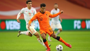 AMSTERDAM, NETHERLANDS - NOVEMBER 11: Owen Wijndal of Netherlands battles for possession with Gerard Moreno of Spain during the international friendly match between Netherlands and Spain at Johan Cruijff Arena on November 11, 2020 in Amsterdam, Netherland