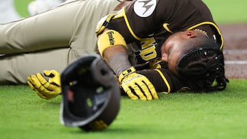 Apr 20, 2025; Houston, Texas, USA;San Diego Padres designated hitter Luis Arraez (4) lies on the field after colliding with Houston Astros first baseman Christian Walker (8) (not pictured )on the first base line in the first inning at Daikin Park. Mandatory Credit: Thomas Shea-Imagn Images