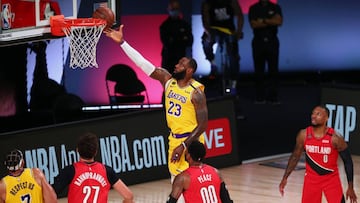 Aug 20, 2020; Lake Buena Vista, Florida, USA; Los Angeles Lakers forward LeBron James (23) shoots a layup over Portland Trail Blazers center Jusuf Nurkic (27) and forward Carmelo Anthony (00) and guard Damian Lillard (0) during the first half of a NBA basketball first round playoff game in the 2020 NBA playoffs at AdventHealth Arena. Mandatory Credit: Kim Klement-USA TODAY Sports