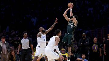 Jayson Tatum #0 of the Boston Celtics scores on a jumper over LeBron James #6 of the Los Angeles Lakers, to tie the game 110-110, sending the game into overtime, during a 122-118 overtime win over the Los Angeles Lakers at Crypto.com Arena on December 13, 2022 in Los Angeles, California.