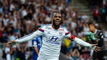 This file photo taken on April 15, 2015 shows Lyon's French forward Alexandre Lacazette celebrating after scoring a goal during the French L1 football match Olympique Lyonnais