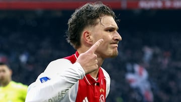 Ajax's Belgian forward #11 Mika Godts celebrates after scoring his team's first goal during the Dutch Eredivisie football match between Ajax Amsterdam and Heracles Amelo at the Johan Cruijff ArenA in Amsterdam on February 16, 2025. (Photo by MAURICE VAN STEEN / ANP / AFP) / Netherlands OUT