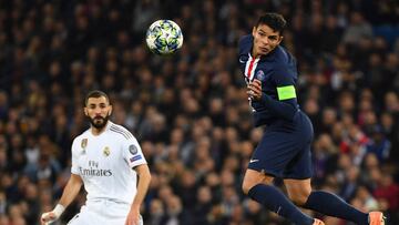 Paris Saint-Germain&#039;s Brazilian defender Thiago Silva (2R) jumps for the ball next to Real Madrid&#039;s French forward Karim Benzema during the UEFA Champions League group A football match Real Madrid against Paris Saint-Germain FC at the Santiago B