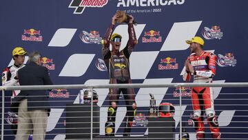 Apr 10, 2022; Austin, Texas, USA; Tony Arbolino of Italy, center, celebrates on the podium as Jake Dixon of England, right, watches after winning the Moto2 race at the Red Bull Grand Prix of the Americas MotoGP at Circuit of the Americas. Dixon finished t