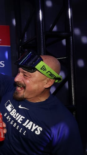 TORONTO, ONTARIO - OCTOBER 20: Alejandro Kirk #30 of the Toronto Blue Jays celebrates in the locker room after the Blue Jays defeated the Seattle Mariners in game seven of the American League Championship Series at the Rogers Centre on October 20, 2025 in Toronto, Ontario. Cole Burston/Getty Images/AFP (Photo by Cole Burston / GETTY IMAGES NORTH AMERICA / Getty Images via AFP)