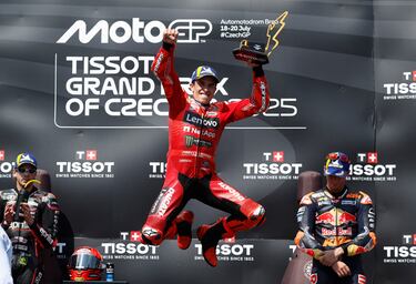 MotoGP - Czech Republic Grand Prix - Masaryk Circuit, Brno, Czech Republic - July 20, 2025 Ducati Lenovo Team's Marc Marquez celebrates with a trophy on the podium after winning the MotoGP race REUTERS/David W Cerny