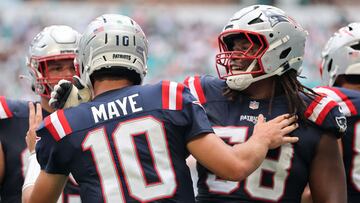 MIAMI GARDENS, FLORIDA - SEPTEMBER 14: Drake Maye #10 of the New England Patriots is congratulated by Hunter Henry #85 of after scoring a rushing touchdown against the Miami Dolphins during the second half in the game at Hard Rock Stadium on September 14, 2025 in Miami Gardens, Florida. Carmen Mandato/Getty Images/AFP (Photo by Carmen Mandato / GETTY IMAGES NORTH AMERICA / Getty Images via AFP)