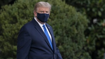 U.S. President Donald Trump walks to the South Lawn of the White House before boarding Marine One in Washington, D.C., U.S., on Friday, Oct. 2, 2020. Trump will be taken to Walter Reed National Military Medical Center to be treated for Covid-19, the White