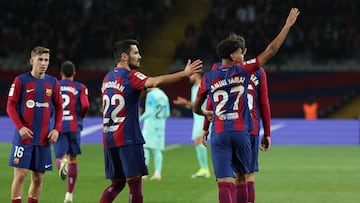 Barcelona's Spanish forward #27 Lamine Yamal (R) celebrates with teammates after scoring his team's first goal during the Spanish league football match between FC Barcelona and RCD Mallorca at the Estadi Olimpic Lluis Companys in Barcelona on March 8, 2024. (Photo by LLUIS GENE / AFP)