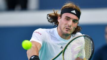 Greek player Stefanos Tsitsipas returns the ball to British player Cameron Norrie during a tennis match at the International Tennis Centre in Abu Dhabi as part of the Mubadala championship, on December 16, 2022. (Photo by Ryan LIM / AFP)