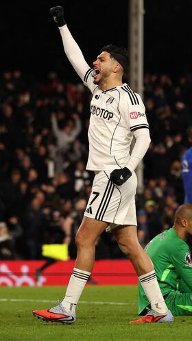 Fulham's Mexican striker #07 Raul Jimenez celebrates after Fulham's Welsh midfielder #08 Harry Wilson (L) scores the team's second goal during the English Premier League football match between Fulham and Chelsea at Craven Cottage in London on January 7, 2026. (Photo by Adrian Dennis / AFP) / RESTRICTED TO EDITORIAL USE. No use with unauthorized audio, video, data, fixture lists, club/league logos or 'live' services. Online in-match use limited to 120 images. An additional 40 images may be used in extra time. No video emulation. Social media in-match use limited to 120 images. An additional 40 images may be used in extra time. No use in betting publications, games or single club/league/player publications. /