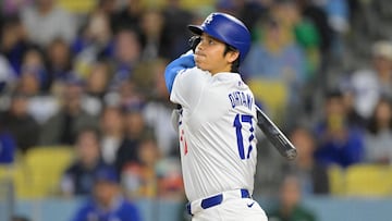 LOS ANGELES, CALIFORNIA - APRIL 12: Shohei Ohtani #17 of the Los Angeles Dodgers watches the flight of the ball on a solo home run in the first inning against the San Diego Padres at Dodger Stadium on April 12, 2024 in Los Angeles, California.   Jayne Kamin-Oncea/Getty Images/AFP (Photo by Jayne Kamin-Oncea / GETTY IMAGES NORTH AMERICA / Getty Images via AFP)