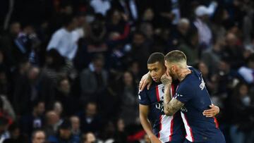 Paris Saint-Germain's Spanish defender Sergio Ramos (R) speaks to Paris Saint-Germain's French forward Kylian Mbappe as they celebrate team's first goal during the UEFA Champions League group H football match between Paris Saint-Germain (PSG) and SL Benfica, at The Parc des Princes Stadium, on October 11, 2022. (Photo by FRANCK FIFE / AFP) (Photo by FRANCK FIFE/AFP via Getty Images)