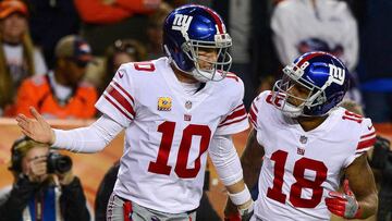 DENVER, CO - OCTOBER 15: Quarterback Eli Manning #10 of the New York Giants celebrates with Roger Lewis #18 after the two connected for a second quarter touchdown against the Denver Broncos at Sports Authority Field at Mile High on October 15, 2017 in Denver, Colorado. Dustin Bradford/Getty Images/AFP
== FOR NEWSPAPERS, INTERNET, TELCOS & TELEVISION USE ONLY ==