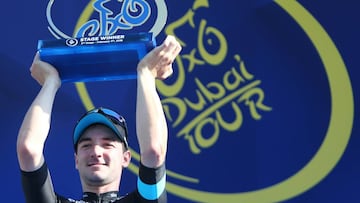 Italian Cyclist Elia Viviani of Team SKY jubilates with the winners trophy on the podium after winning the the second stage of Dubai Tour 2016.