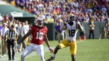 Sep 3, 2016; Green Bay, WI, USA; LSU Tigers cornerback Tre'Davious White (18) intercepts a pass intended for Wisconsin Badgers wide receiver Robert Wheelwright (15) and returns it for a touchdown in the 3rd quarter at Lambeau Field. Mandatory Credit: Benny Sieu-USA TODAY Sports