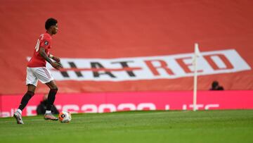 Manchester United's English striker Marcus Rashford runs with the ball during the English Premier League football match between Manchester United and Southampton at Old Trafford in Manchester, north-west England, on July 13, 2020. (Photo by PETER POW