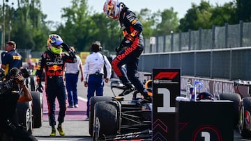 First placed Red Bull Racing's Dutch driver Max Verstappen (C) gets out of his car next to second-placed Red Bull Racing's Mexican driver Sergio Perez (L) after the the Italian Formula One Grand Prix race at Autodromo Nazionale Monza circuit, in Monza on September 3, 2023. Max Verstappen won a record-breaking 10th straight Formula One race on September 3, 2023, after coming out on top at the Italian Grand Prix in a Red Bull one-two at Monza. (Photo by Ben Stansall / AFP)