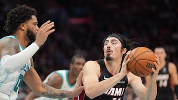 Apr 14, 2026; Charlotte, North Carolina, USA; Miami Heat guard Jaime Jaquez Jr. (11) handles the ball against Charlotte Hornets forward Miles Bridges (0) during the second quarter during the play-in rounds between the Charlotte Hornets and the Miami Heat of the 2026 NBA Playoffs at Spectrum Center. Mandatory Credit: Jim Dedmon-Imagn Images
