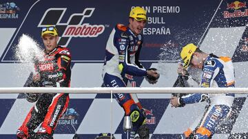 Second placed Jorge Navarro of Spain, winner Lorenzo Baldassarri of Italy and =third placed Augusto Fernandez of Spain, from left to right, celebrate on the podium of the Moto 2 race of the Spanish Motorcycle Grand Prix at the Angel Nieto racetrack in Jerez de la Frontera, Spain, Sunday, May 5, 2019. (AP Photo/Miguel Morenatti)