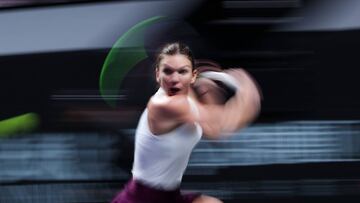 SHENZHEN, CHINA - OCTOBER 28: Simona Halep of Romania plays a backhand against Bianca Andreescu of Canada during their Women's Singles match on Day Two of the 2019 Shiseido WTA Finals at Shenzhen Bay Sports Center on October 28, 2019 in Shenzhen, China. (Photo by Lintao Zhang/Getty Images)